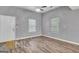 Bright living room with hardwood floors and ceiling fan at 6350 Park St, Union City, GA 30291