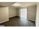 Bright basement room with sliding glass door and laminate wood floor at 2959 Fairburn Rd, Atlanta, GA 30331