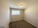 Well-lit bedroom with neutral walls and brown carpeting at 2959 Fairburn Rd, Atlanta, GA 30331