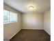 Bright bedroom with neutral walls and brown carpeting at 2959 Fairburn Rd, Atlanta, GA 30331