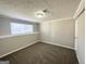 Spacious bedroom with neutral walls and brown carpeting at 2959 Fairburn Rd, Atlanta, GA 30331