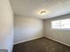 Spacious bedroom with neutral walls and brown carpeting at 2959 Fairburn Rd, Atlanta, GA 30331