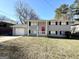 Two-story house with gray siding, red door, and attached garage at 2959 Fairburn Rd, Atlanta, GA 30331