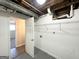 Unfinished laundry area with shelving and hookups at 2959 Fairburn Rd, Atlanta, GA 30331