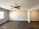 Bright living room with dark gray vinyl flooring and ceiling fan at 2959 Fairburn Rd, Atlanta, GA 30331
