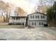 Gray sided house with stone accents and a covered porch at 1618 Old Alabama Rd, Austell, GA 30168