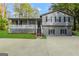 Ranch style home with gray siding, stone accents, and a covered porch at 1618 Old Alabama Rd, Austell, GA 30168