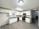 Modern kitchen with white cabinets, granite countertops, and stainless steel appliances at 1618 Old Alabama Rd, Austell, GA 30168