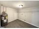 Laundry room with linoleum flooring, water heater, and storage at 1618 Old Alabama Rd, Austell, GA 30168