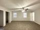 Spacious main bedroom with carpet flooring and ceiling fan at 1618 Old Alabama Rd, Austell, GA 30168