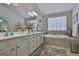 Main bathroom boasts a soaking tub and double vanity at 32 American Walk, Peachtree City, GA 30269