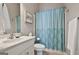 Clean bathroom with light blue shower curtain at 32 American Walk, Peachtree City, GA 30269