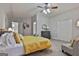 Bedroom with yellow bedding and access to bath at 32 American Walk, Peachtree City, GA 30269