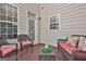 Relaxing deck with wicker furniture and red cushions at 32 American Walk, Peachtree City, GA 30269