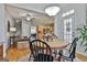 Kitchen dining area with hardwood floors and a view into the living room at 32 American Walk, Peachtree City, GA 30269