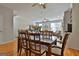 Open concept dining area with hardwood floors, adjacent to the living room at 32 American Walk, Peachtree City, GA 30269