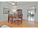 Bright dining room with hardwood floors and a view into the living area at 32 American Walk, Peachtree City, GA 30269