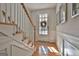 Light entryway with hardwood floors and staircase at 32 American Walk, Peachtree City, GA 30269