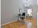 Home office with hardwood floors, built-in shelving, and a large window at 32 American Walk, Peachtree City, GA 30269
