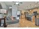 Open concept kitchen with light wood cabinets, stainless steel appliances, and hardwood floors at 32 American Walk, Peachtree City, GA 30269