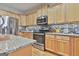 Modern kitchen with granite countertops and stainless steel appliances at 32 American Walk, Peachtree City, GA 30269