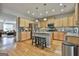 Modern kitchen with granite counters, stainless steel appliances and an island at 32 American Walk, Peachtree City, GA 30269