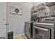 Laundry room with washer, dryer, and shelving at 32 American Walk, Peachtree City, GA 30269