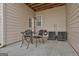 Concrete patio with table, chairs, and AC units at 32 American Walk, Peachtree City, GA 30269