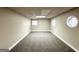 Finished basement room with neutral walls and carpet flooring at 3138 Beechwood Dr, Lithia Springs, GA 30122