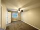 Bedroom with neutral carpeting, ceiling fan, and window at 3138 Beechwood Dr, Lithia Springs, GA 30122