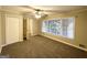 Spacious bedroom with neutral carpeting and large window at 3138 Beechwood Dr, Lithia Springs, GA 30122