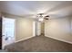 Spacious bedroom with ceiling fan and carpet flooring at 3138 Beechwood Dr, Lithia Springs, GA 30122