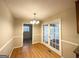 Dining room with hardwood floors, chandelier, and French doors at 3138 Beechwood Dr, Lithia Springs, GA 30122