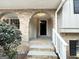 Brick front porch with arched entryway and white railing at 3138 Beechwood Dr, Lithia Springs, GA 30122