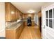 Kitchen with wood cabinets, granite counters, and black appliances at 3138 Beechwood Dr, Lithia Springs, GA 30122