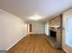 Living room with hardwood floors and brick fireplace at 3138 Beechwood Dr, Lithia Springs, GA 30122