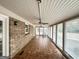 Sunroom with tile floor, ceiling fan and windows at 3138 Beechwood Dr, Lithia Springs, GA 30122