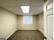 Spacious finished basement room with carpeted floor and window at 4037 Regent St, Douglasville, GA 30134