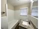 Updated bathroom with granite vanity and tiled tub at 4037 Regent St, Douglasville, GA 30134