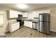 Modern kitchen with granite countertops and white cabinets at 4037 Regent St, Douglasville, GA 30134