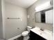 Modern bathroom with gray vanity, toilet, and a view of a shower at 121 Pine Forest Dr, Dallas, GA 30157