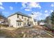 View of the home's backyard with lawn, fencing, and exterior of the house on a sunny day at 319 Allegrini Dr, Atlanta, GA 30349