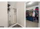 Bathroom features a glass-enclosed shower with a view of a well-organized walk-in closet at 319 Allegrini Dr, Atlanta, GA 30349