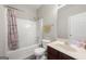 Cozy bathroom with a shower-tub combo and a vanity sink, offering a clean and functional space at 319 Allegrini Dr, Atlanta, GA 30349