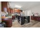 Spacious kitchen with a central island, wooden cabinets, and modern stainless-steel appliances at 319 Allegrini Dr, Atlanta, GA 30349