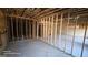 Unfinished basement with framed walls and plumbing rough-in at 352 Traditions Ln, Hampton, GA 30228