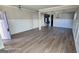 Spacious living room with hardwood floors and elegant wainscoting at 352 Traditions Ln, Hampton, GA 30228