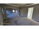 Large main bedroom with plush carpeting and ensuite bathroom access at 352 Traditions Ln, Hampton, GA 30228