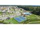 Aerial view of community with pool, tennis courts, and homes at 300 Silver Moon Drive, Loganville, GA 30052