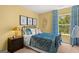 Bright bedroom with blue bedding and gold accents at 300 Silver Moon Drive, Loganville, GA 30052